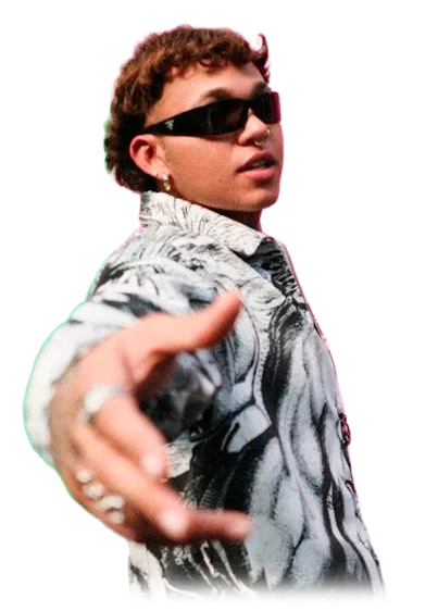 Beéle con gafas oscuras y camisa estampada, con la mano extendida hacia el frente.